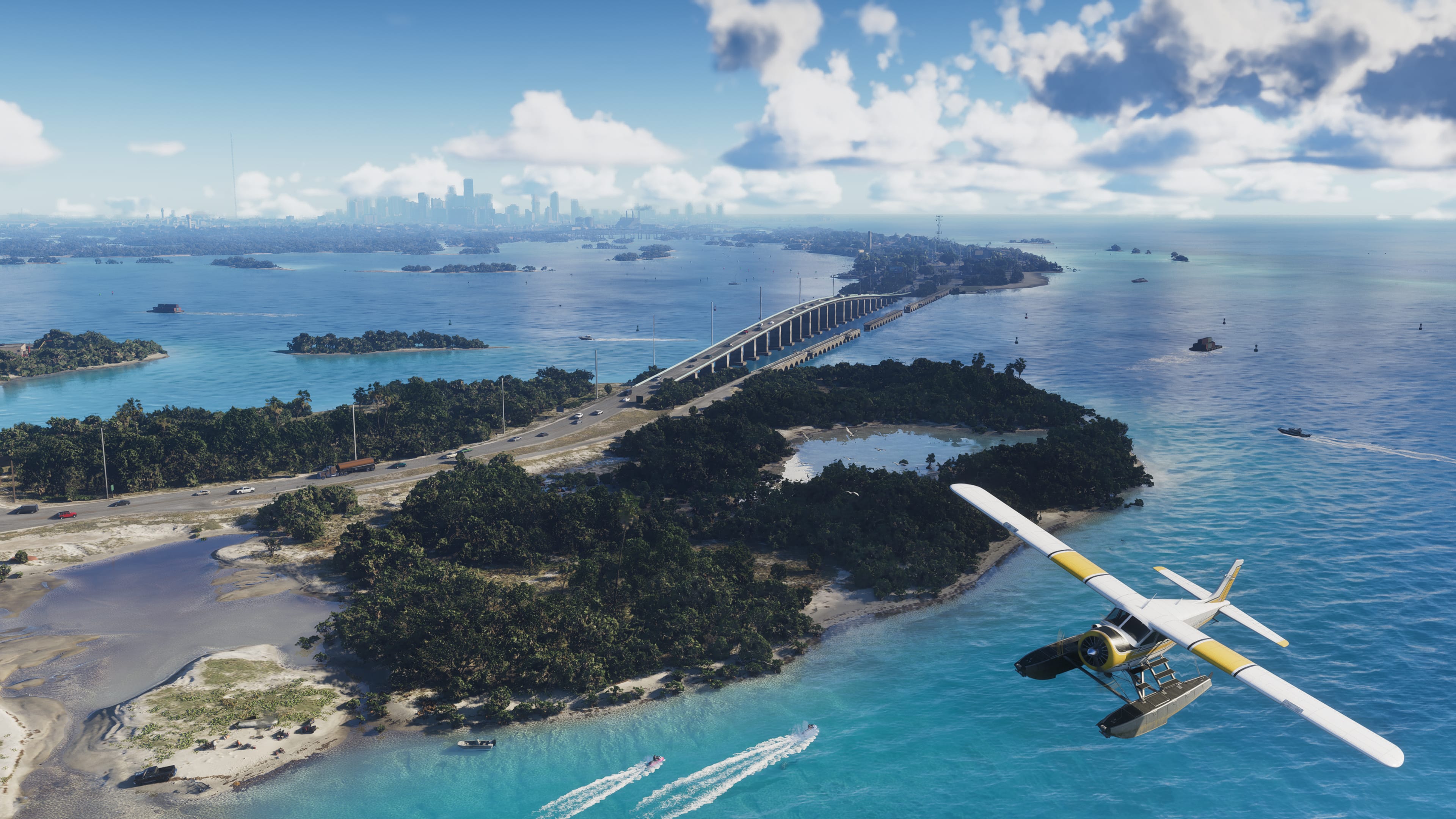 Official Grand Theft Auto VI screenshot: a seaplane flies over green islands, a long bridge and turquoise water in the Leonida Keys, with a city skyline in the distance