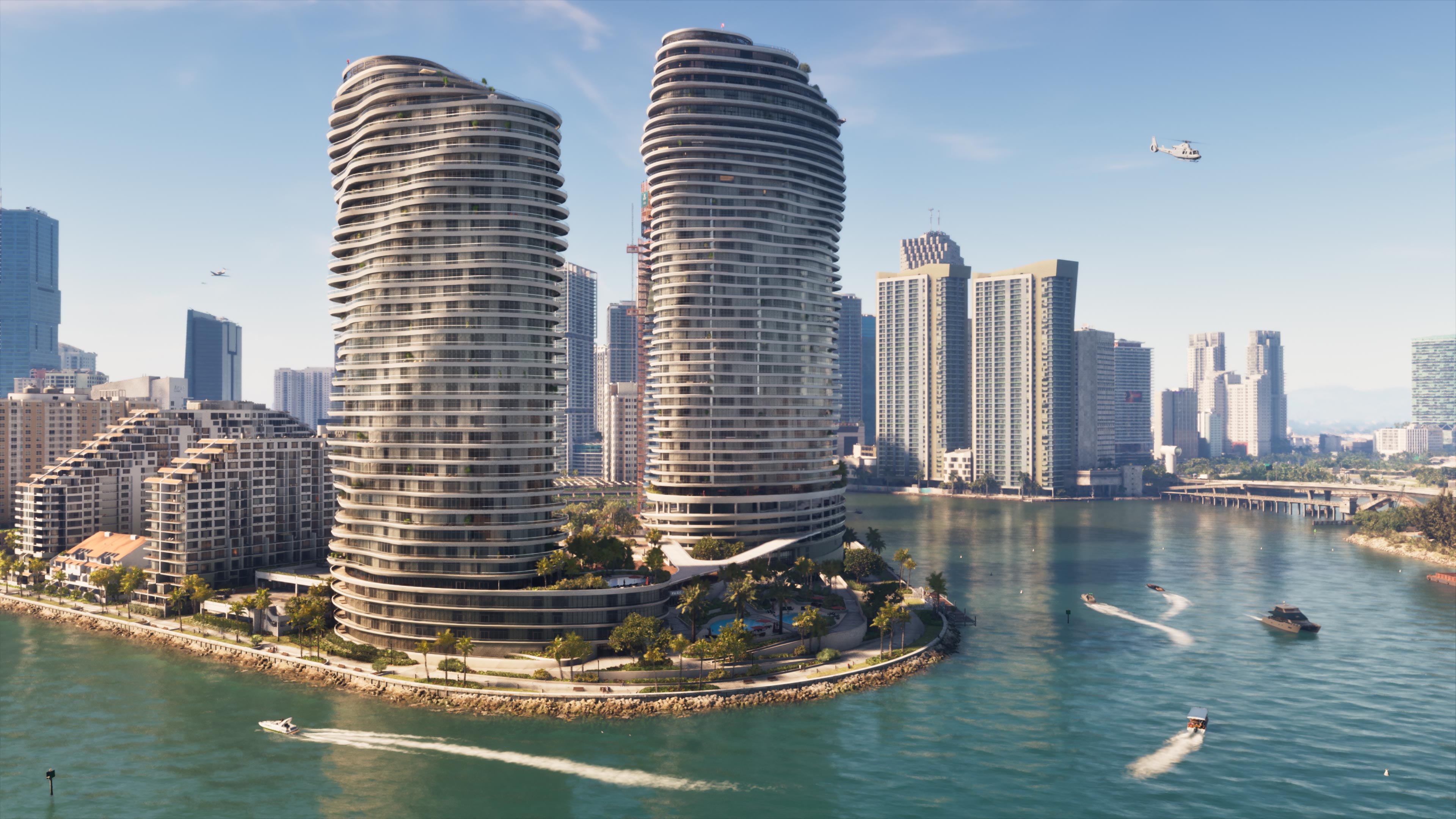 Official Grand Theft Auto VI screenshot: two curved white residential towers on a palm-lined point in Vice City, with speedboats on the bay and a helicopter over the skyline