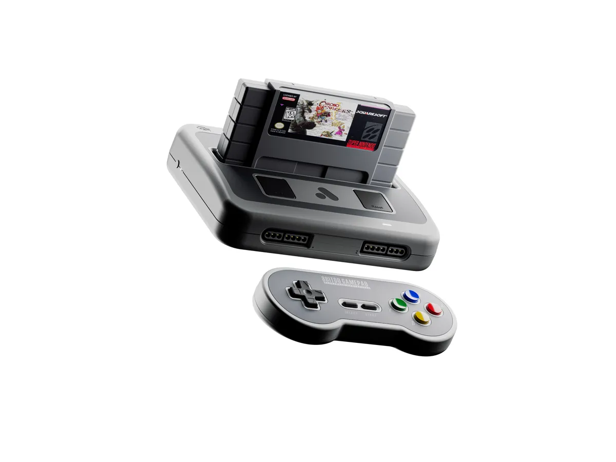 Analogue Super Nt+ with a cartridge inserted, next to an 8BitDo SN30 wireless controller, which is sold separately