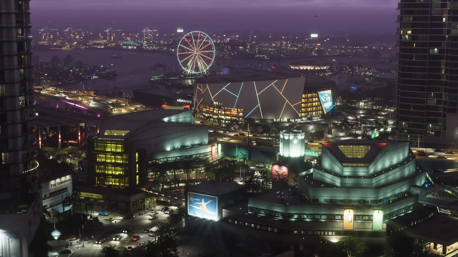 Official Grand Theft Auto VI screenshot: aerial night view of neon-lit Vice City with a stadium, highway and Ferris wheel