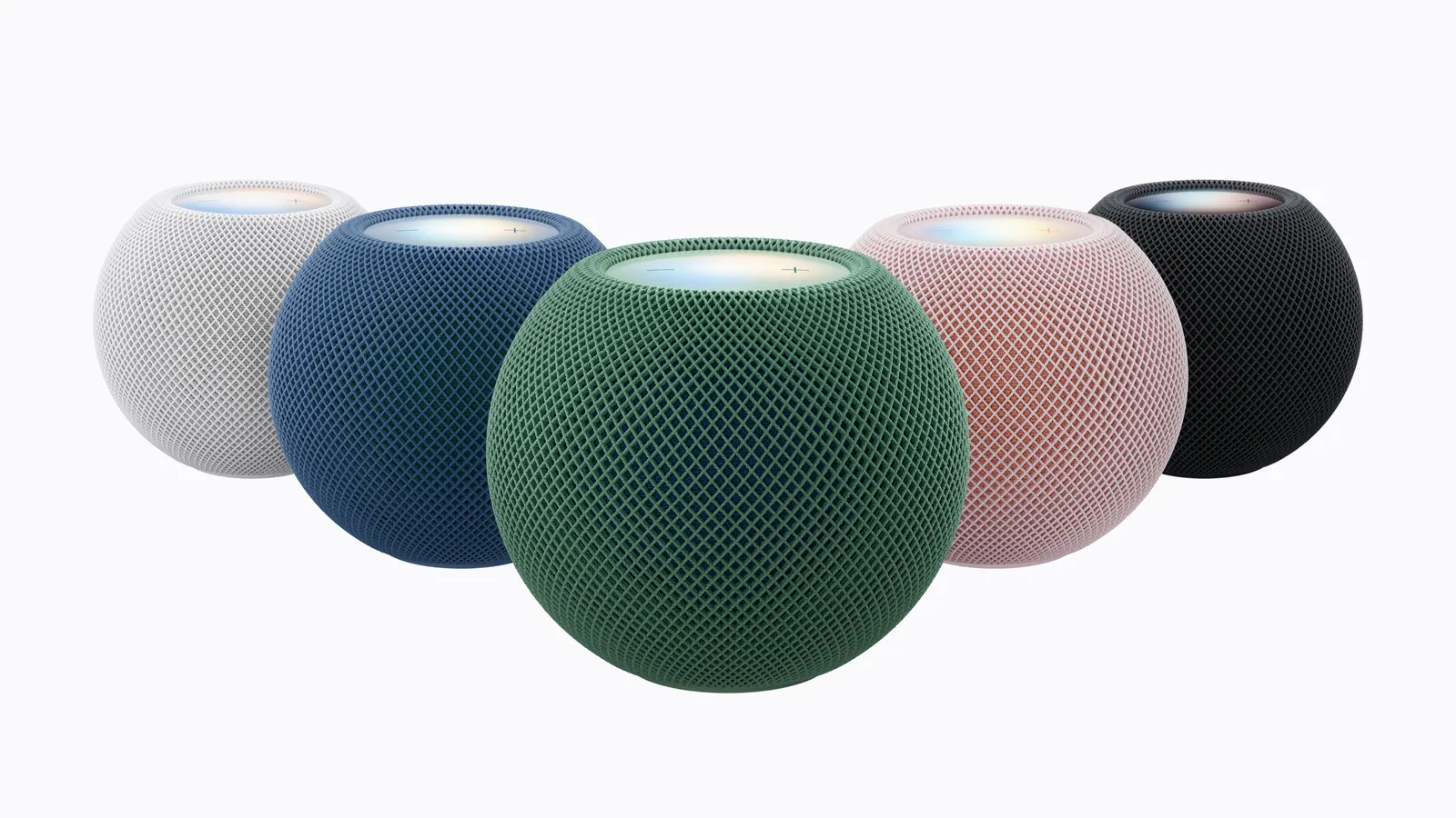HomePod mini 2 in all five colors, white, blue, green, pink and midnight, grouped on a light gray background