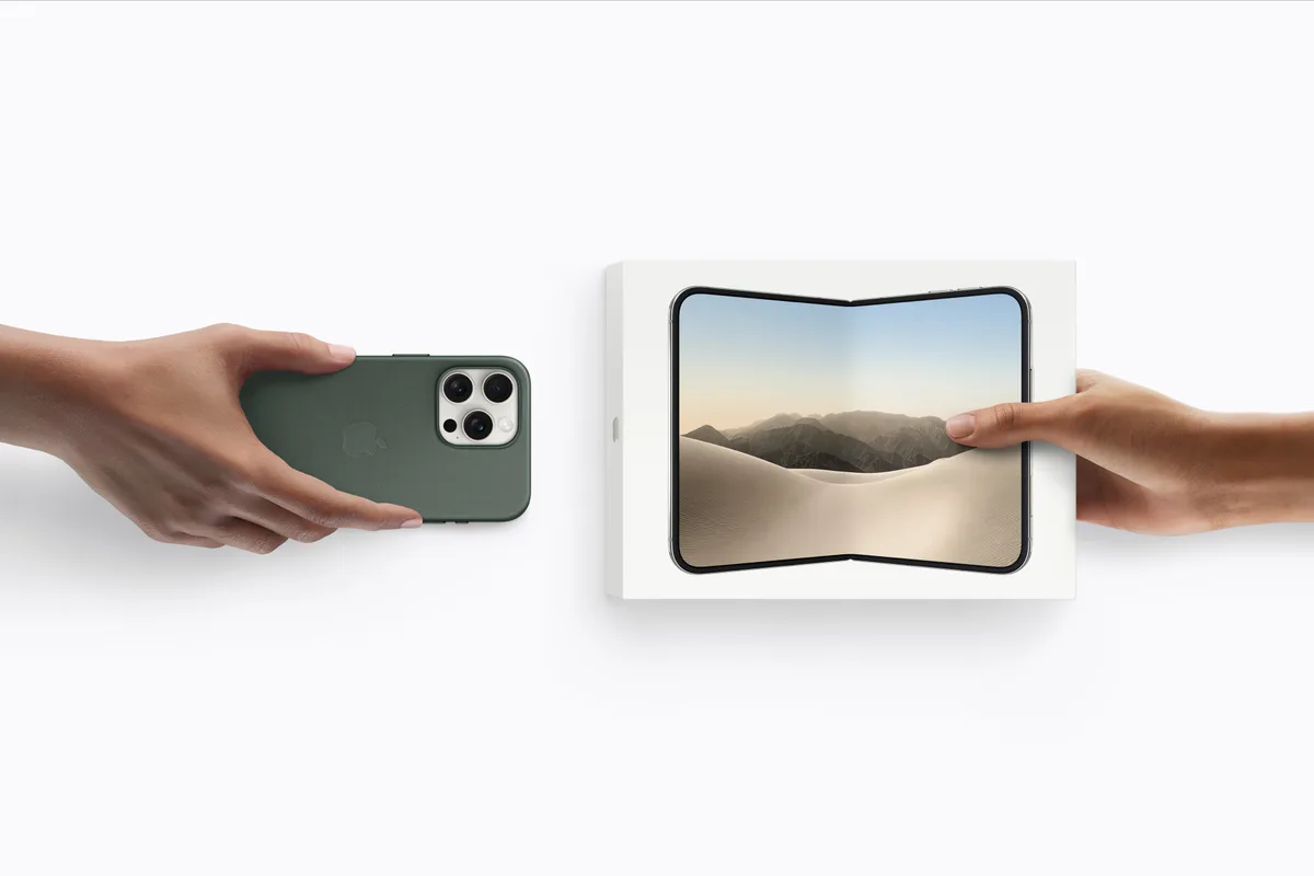 One hand handing over an older iPhone in a green case while another holds out a boxed iPhone Duo, illustrating trade-in