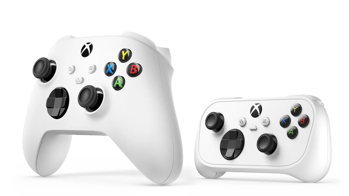 White Xbox Nano Controller beside a larger white standard Xbox Wireless Controller, showing the size difference